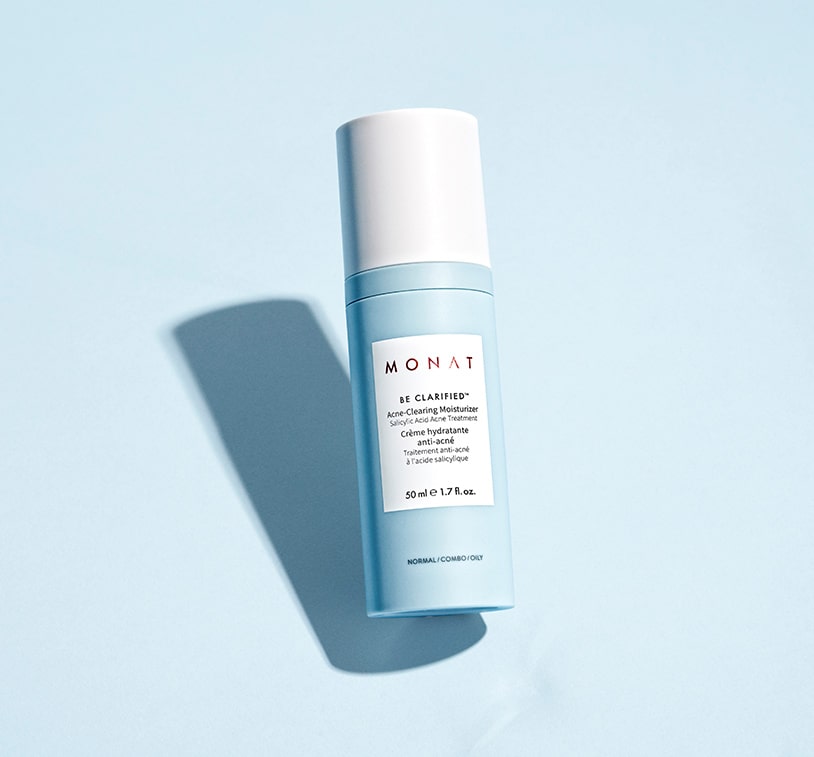 BE CLARIFIED™ Acne-Clearing Moisturizer standing infront of a light blue background. 