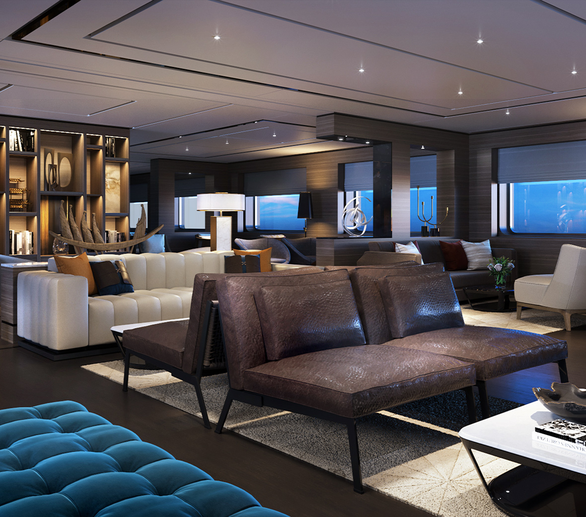A chic lounge area with dark brown and white sofas and love seats, overlooking the ocean.