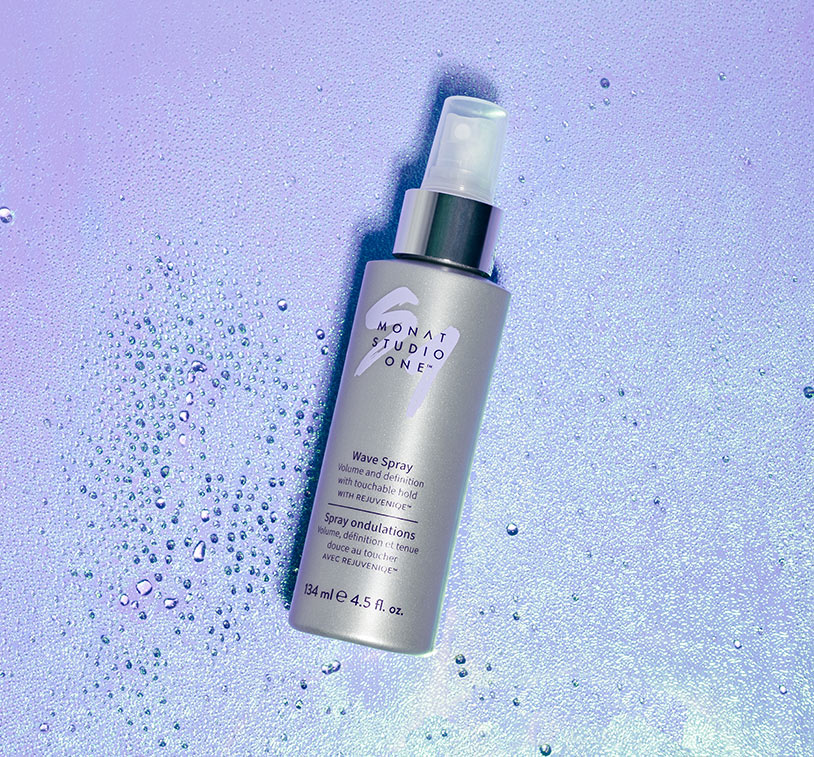 MONAT STUDIO ONE™ Wave Spray on top of an iridescent background. 
