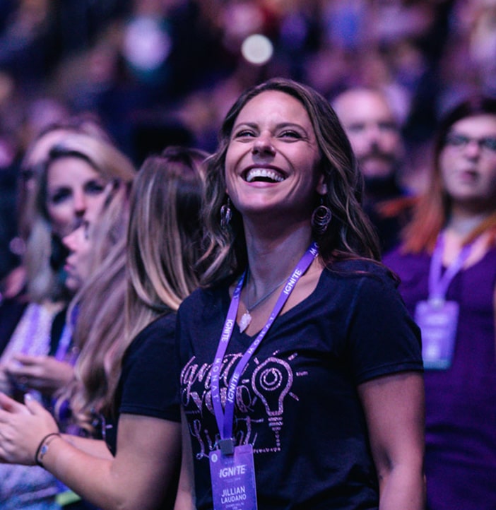 Photo shot of a smiling female in a MONAT convention