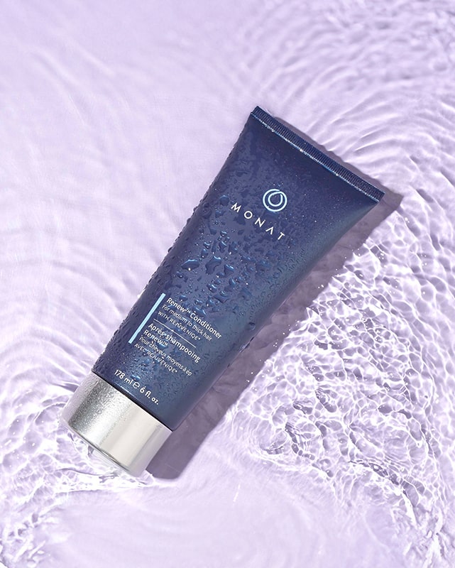 A tube Renew Conditioner on a purple surface.