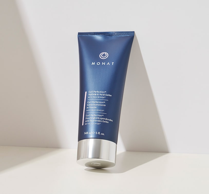 Image of a single tube of 'MONAT Curl Perfecting Hydrate & Hold Gelée' standing upright against a white background.