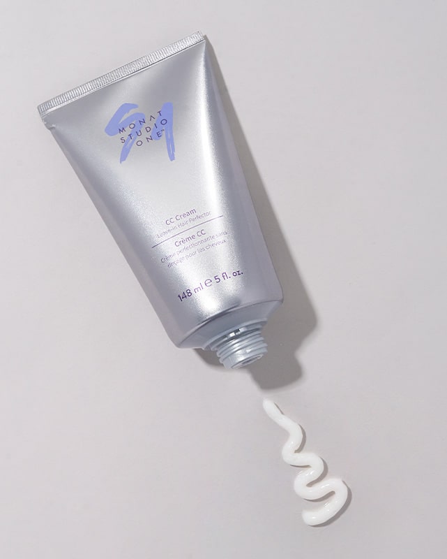 A MONAT STUDIO ONE™ CC Cream tube displayed on a white background, with a portion of the product beside it