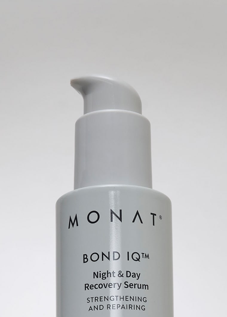 close up of a MONAT BOND IQ serum bottle 