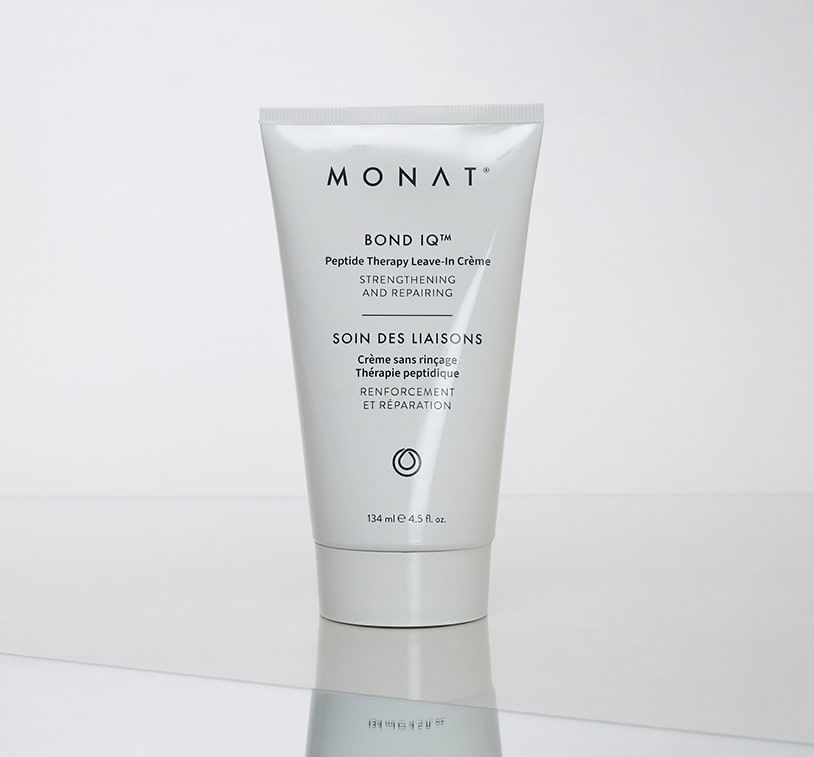 Close-up of MONAT Bond IQ™ Peptide Therapy Leave-In Crème bottle