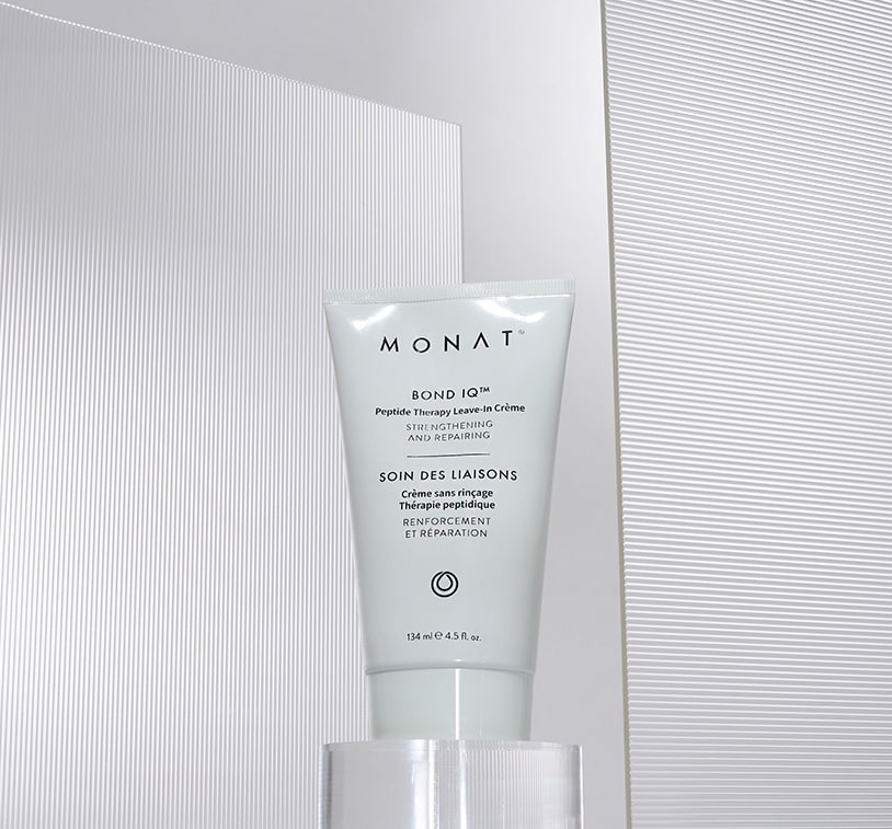 Close-up of MONAT Bond IQ™ Peptide Therapy Leave-In Crème bottle