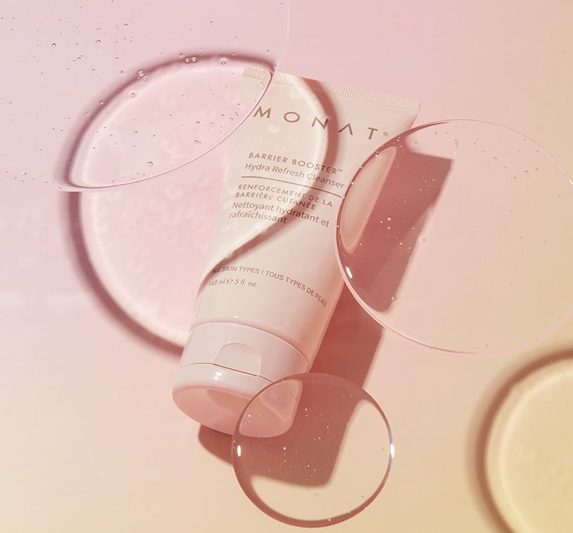 cleanser texture - one on beige surface and one held by hand against pink background