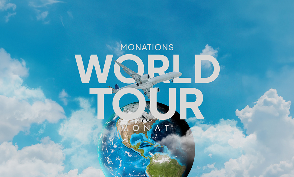 Airplane flying over a globe with “MONATIONS World Tour” text against a blue sky with clouds.
