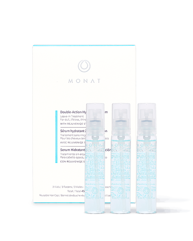 MONAT skincare kit with a white box and three translucent spray bottles in front of it, on a white background.