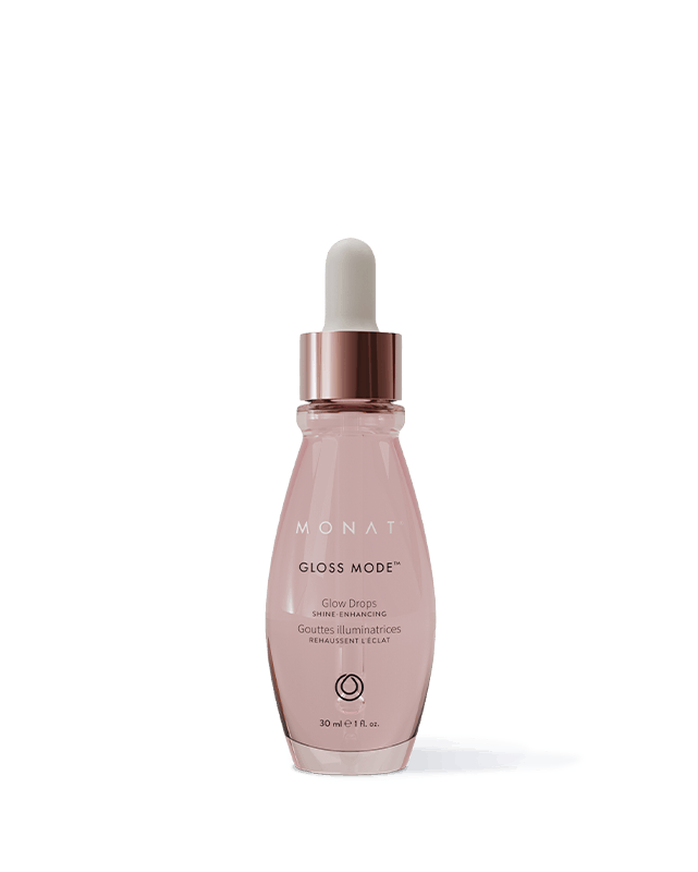 Pink MONAT Glow Drops serum bottle with white dropper cap and rose-gold collar, 30 ml, on a white surface