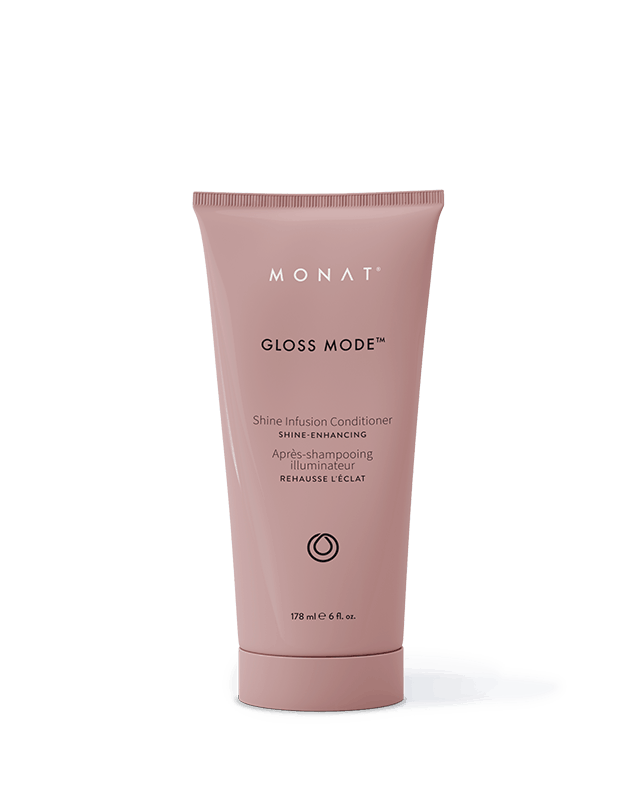 Monat Gloss Mode Shine Infusion Conditioner in a pink tube, standing upright with a shadow below